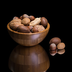 Image showing Nuts in wooden bowl. 