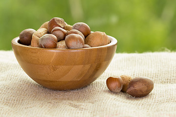 Image showing Nuts in wooden bowl. 