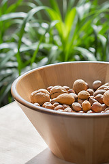 Image showing Nuts in wooden bowl.