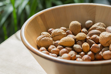 Image showing Nuts in wooden bowl.