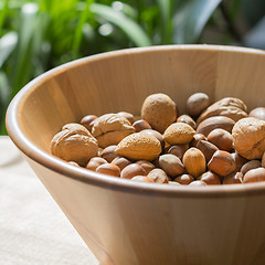 Image showing Nuts in wooden bowl.