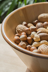 Image showing Nuts in wooden bowl.