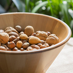 Image showing Nuts in wooden bowl