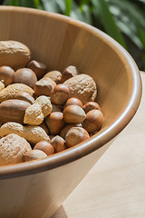 Image showing Nuts in wooden bowl