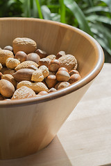 Image showing Nuts in wooden bowl