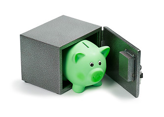 Image showing Green ceramic piggy bank in a safe