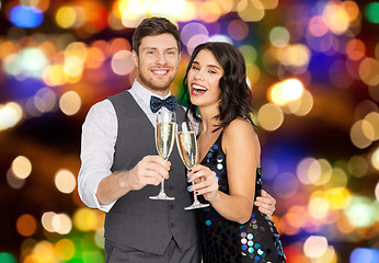 Image showing happy couple with champagne glasses at party