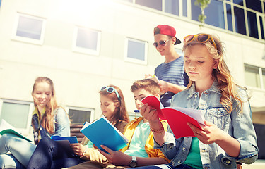 Image showing group of students with notebooks at school yard