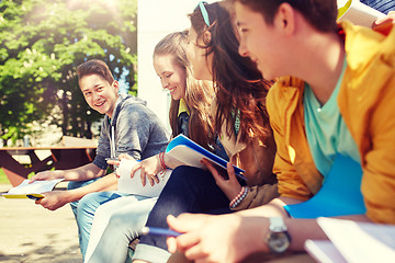 Image showing group of students with notebooks at school yard