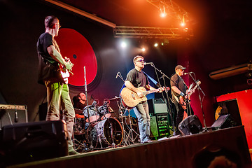 Image showing Band performs on stage in a nightclub