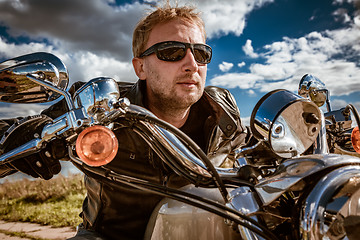 Image showing Biker on a motorcycle