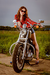 Image showing Biker girl and motorcycle