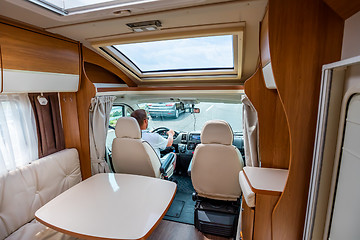 Image showing Man driving on a road in the Camper Van RV