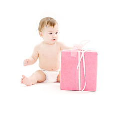 Image showing baby boy in diaper with big gift box