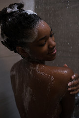 Image showing African American woman in the shower