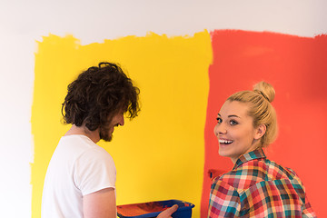 Image showing couple painting interior wall