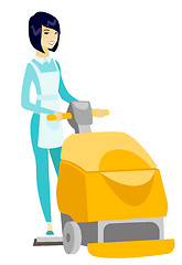 Image showing Asian worker cleaning store floor with machine.