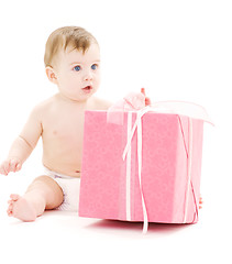 Image showing baby boy in diaper with big gift box