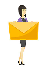 Image showing Smiling business woman holding a big envelope.