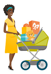 Image showing Young pregnant woman with a pram full of presents.