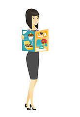 Image showing Successful asian business woman reading magazine.