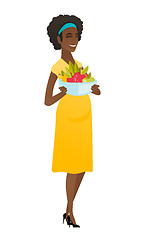 Image showing Young pregnant woman with bowl of fruits.