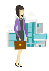 Image showing Asian business woman holding briefcase.