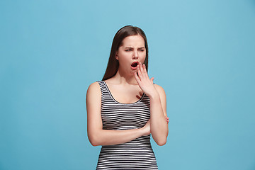 Image showing Beautiful bored woman bored isolated on blue background