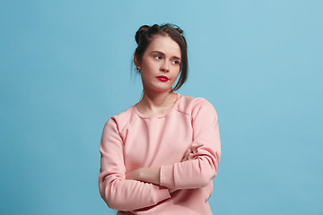 Image showing Beautiful bored woman bored isolated on blue background