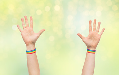 Image showing hands with gay pride rainbow wristbands