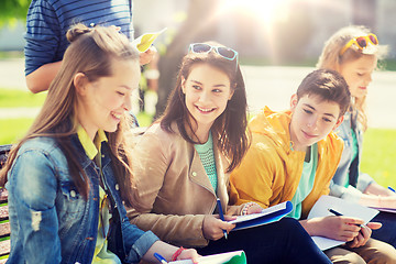 Image showing group of students with notebooks at school yard