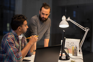 Image showing creative team with computer working late at office