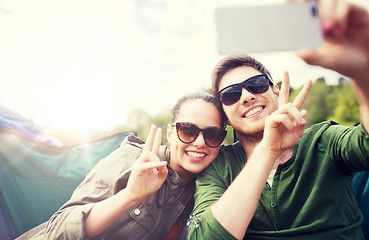 Image showing couple of travelers taking selfie by smartphone