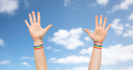 Image showing hands with gay pride rainbow wristbands