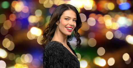 Image showing happy beautiful young woman in black party dress