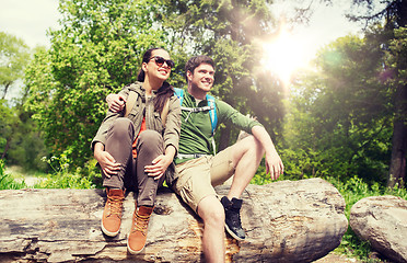 Image showing smiling couple with backpacks in nature