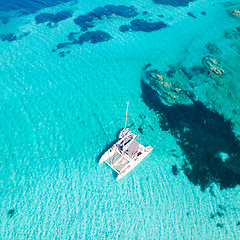Image showing Drone aerial view of catamaran sailing boat in Maddalena Archipelago, Sardinia, Italy.