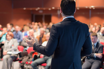 Image showing Public speaker giving talk at business event.