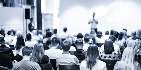 Image showing Business speaker giving a talk at business conference event.