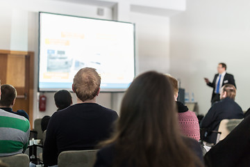 Image showing Business speaker giving a talk at business conference event.