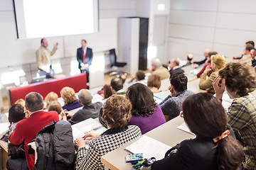 Image showing Business speaker giving a talk at business conference event.