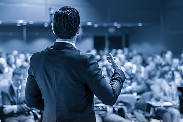 Image showing Public speaker giving talk at business event.