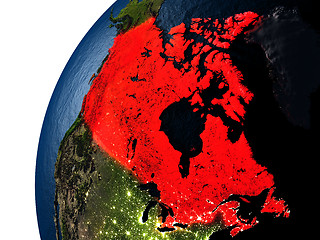 Image showing Canada in red on Earth at night