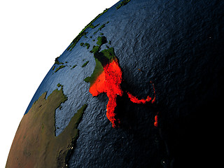 Image showing Papua New Guinea in red on Earth at night