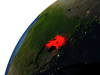 Image showing Uganda in red on Earth at night