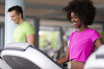 Image showing people exercisinng a cardio on treadmill