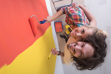 Image showing couple painting interior wall