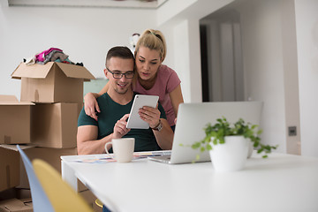 Image showing Young couple moving in a new home