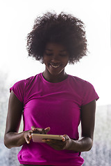 Image showing african american woman using tablet