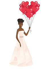 Image showing Bride with bunch of heart-shaped red balloons.